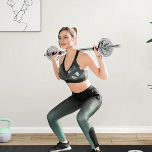 Woman performing squats with a barbell in a home gym setting