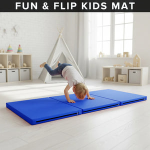 Child doing a handstand on a blue 'Fun & Flip Kids Mat' in a bright room with toys and a teepee.