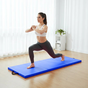 Woman performing a yoga pose on a blue mat in a bright room.