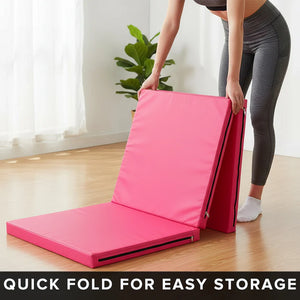 Person folding a pink mat with text 'Quick fold for easy storage' in a room with a plant.