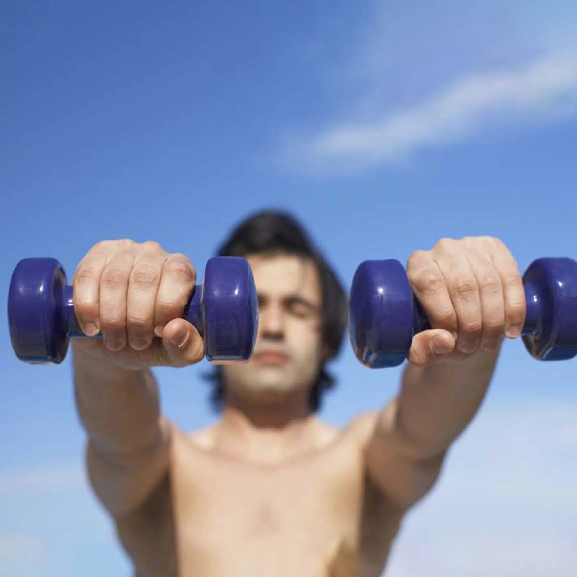 Set of colorful dumbbells with weight markings on a white background