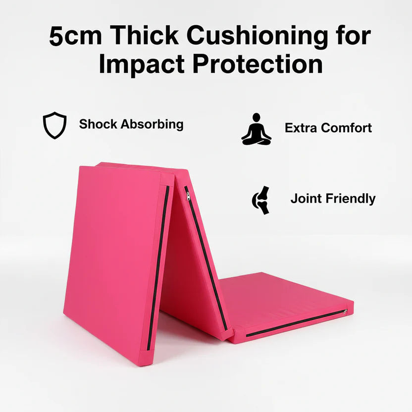 Pink mat with text highlighting 6cm thick cushioning for impact protection, shock absorption, extra comfort, and joint friendliness on a white background.