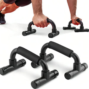Black push-up bars on a white background with a person using them.