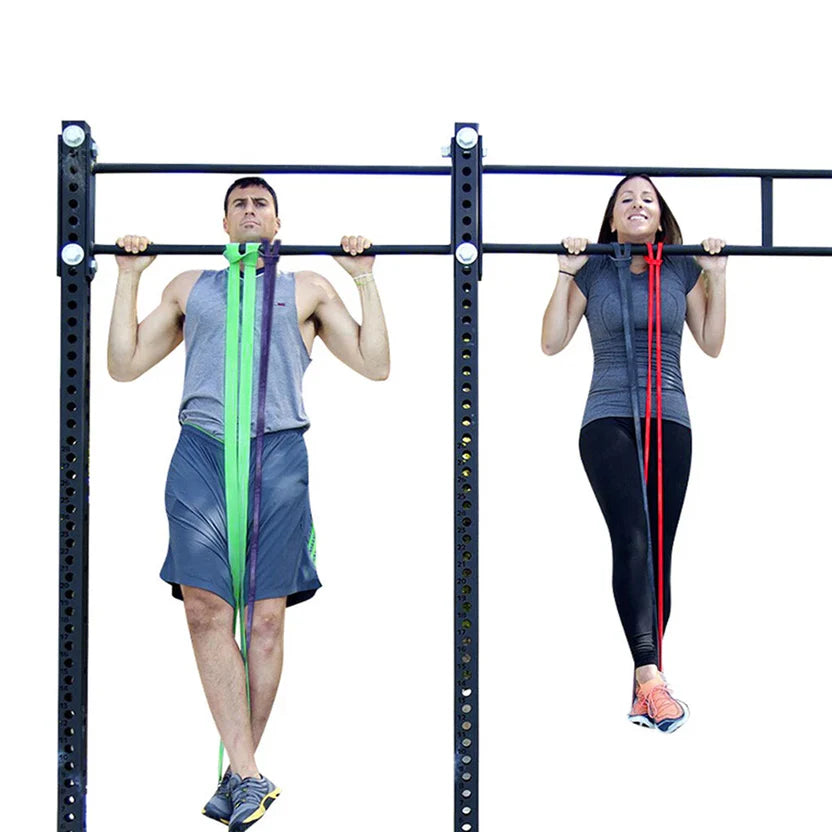 Two people using resistance bands on a pull-up bar against a white background