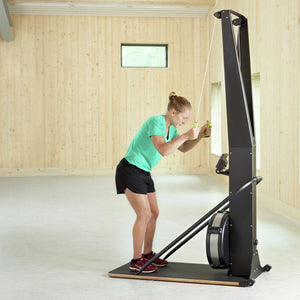 Black and red stationary bike on a white background