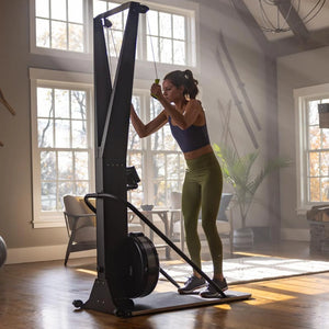 Woman exercising on a stationary bike in a home setting