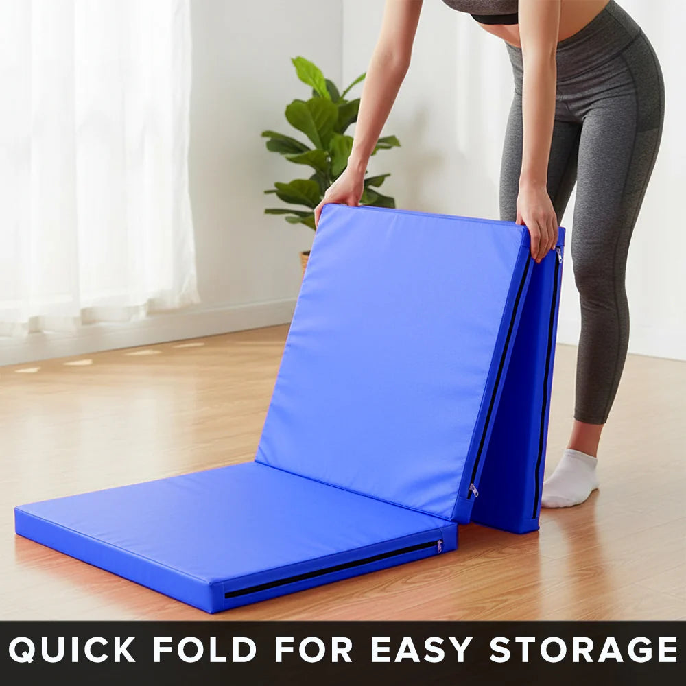 Person folding a blue exercise mat with text 'Quick fold for easy storage' in a home setting.