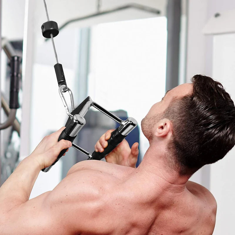 Man using a cable machine in a gym setting
